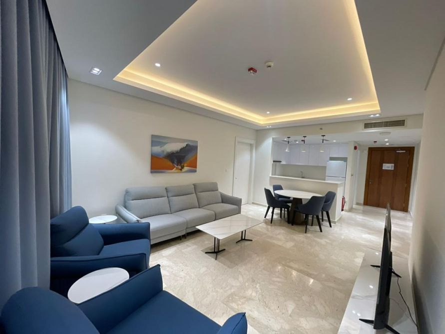 Apartment lounge with navy accent seating