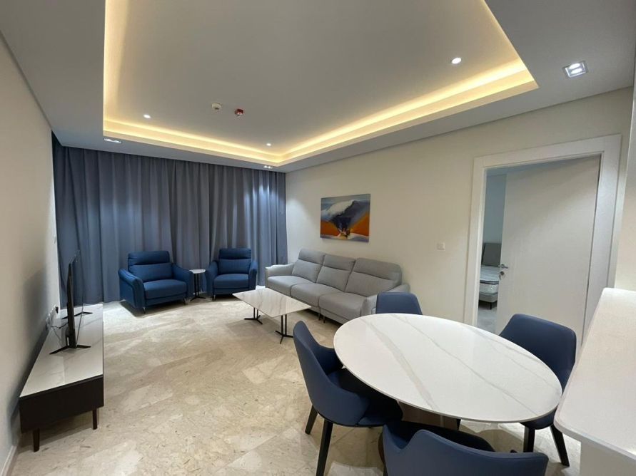 Apartment living room with cove lighting and grey sectional
